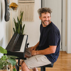 young man sitting at a keyboard