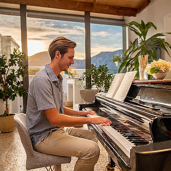 a young man playing piano here are 8 advantages of