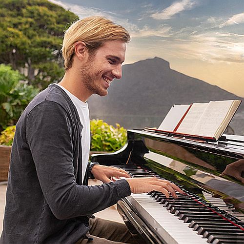 A young male doing effective piano practice